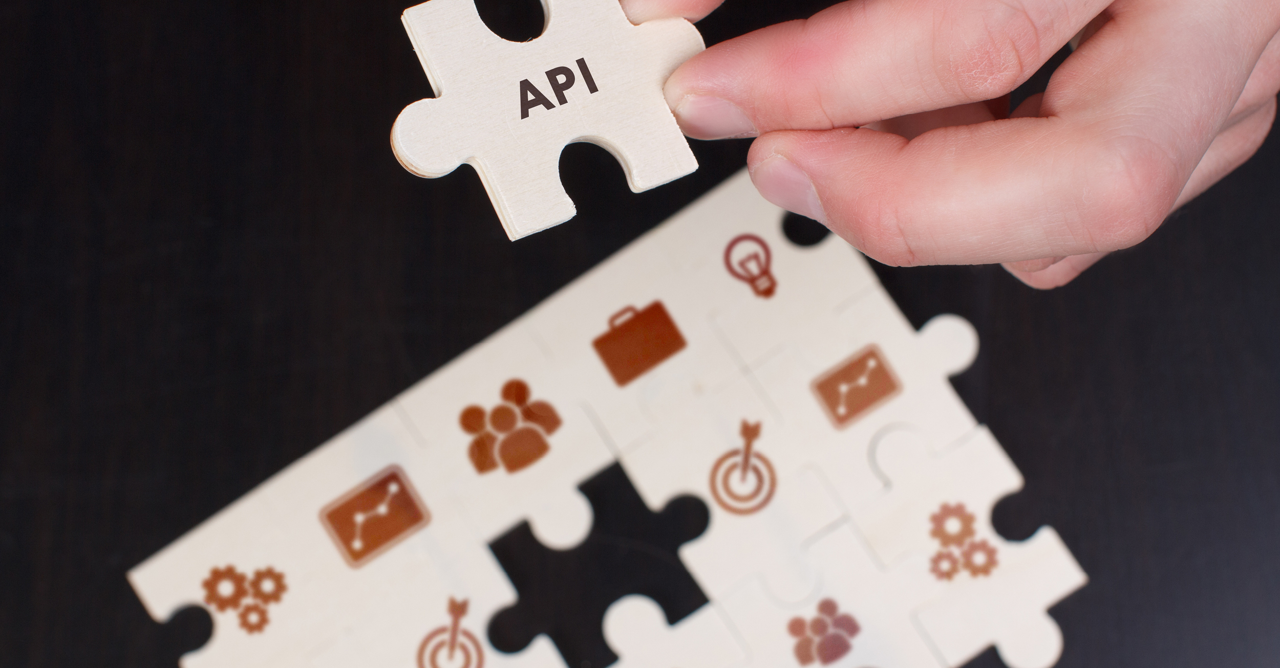 Man placing jigsaw pieces